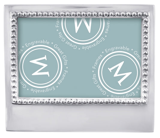A silver frame with silver beading around photo opening and a wide bottom for engraving.