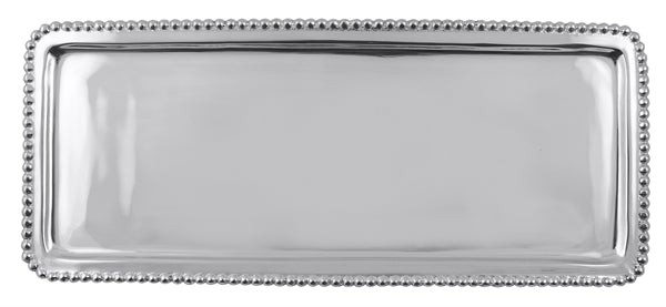 Silver elongated tray with silver beads around the edge. 