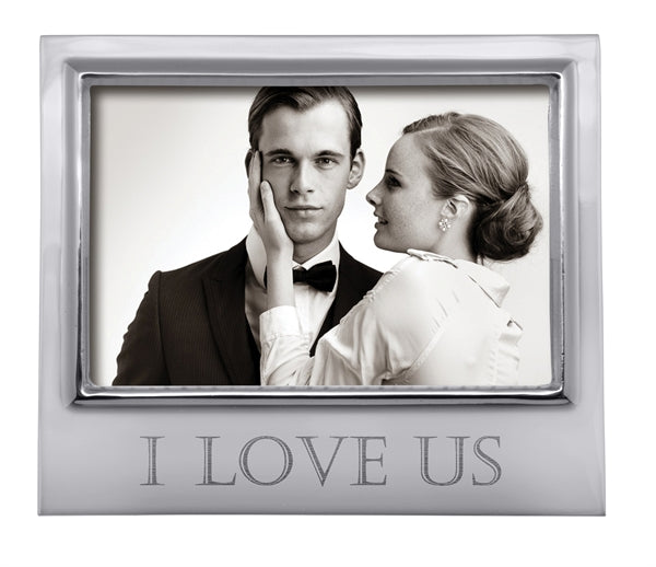 A silver 4x6 horizontal frame with "I LOVE US" engraved in all caps at the bottom in a block font.