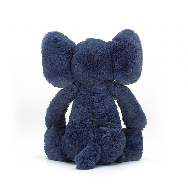 The back side of a navy blue plush elephant.