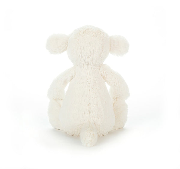 The back side of a plush white little lamb.